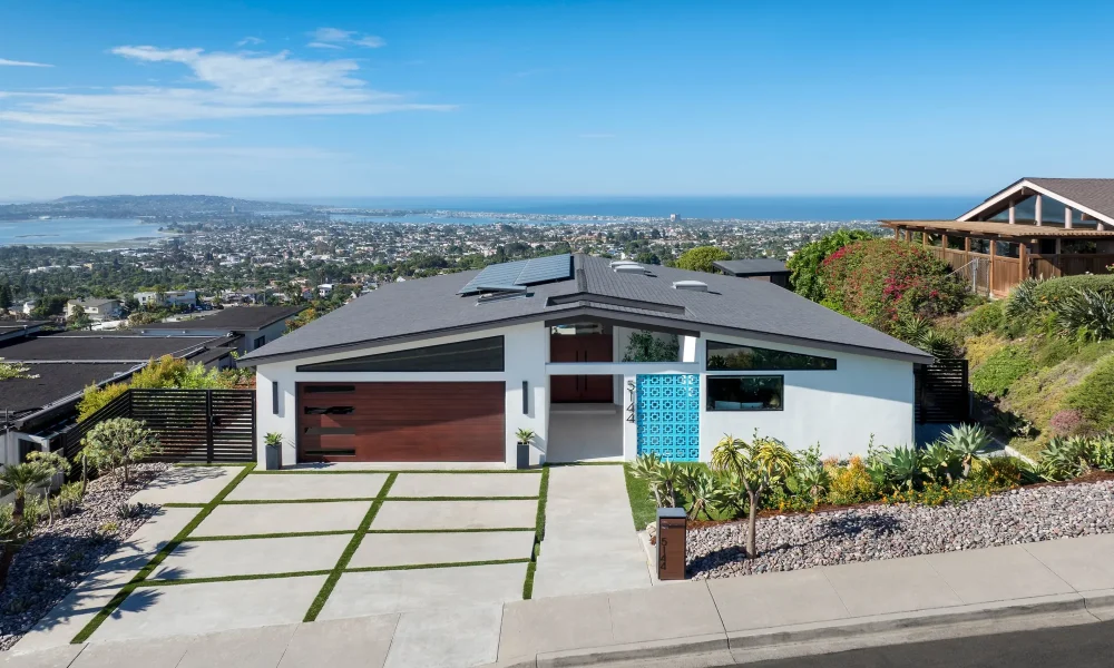 Pacific Beach midcentury modern home with clerestory windows, a turquoise breeze block entry, and views of Mission Bay and the Pacific